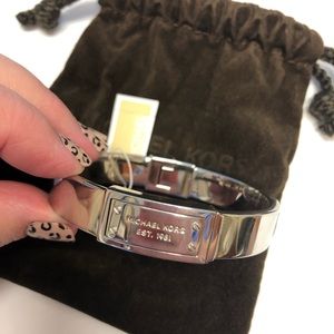 Women’s Michael Kors hinged bangle.
